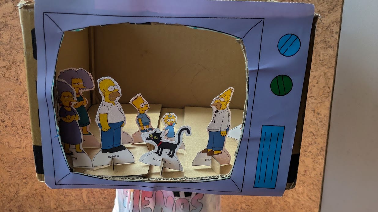 Handmade cardboard TV with Simpsons figures